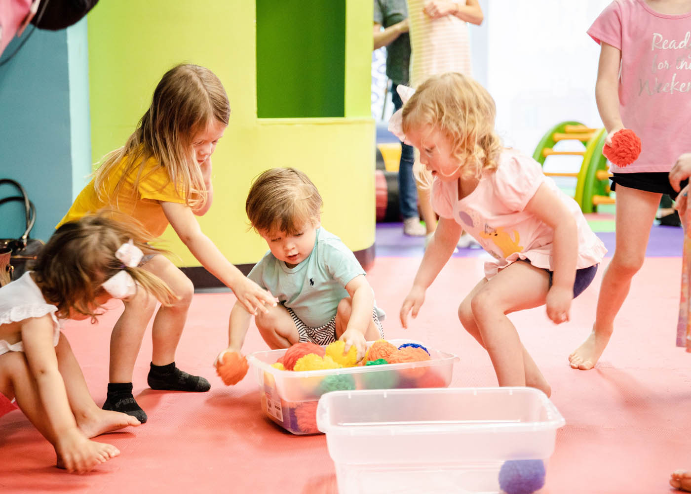 A group of kids playing together at Romp n' Roll's mixed age classes for kids in Willow Grove, PA. 
