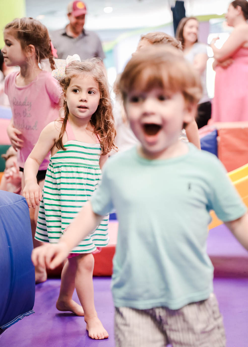 A group of different aged kids at Romp n' Roll at preschool classes in Charlotte, NC.