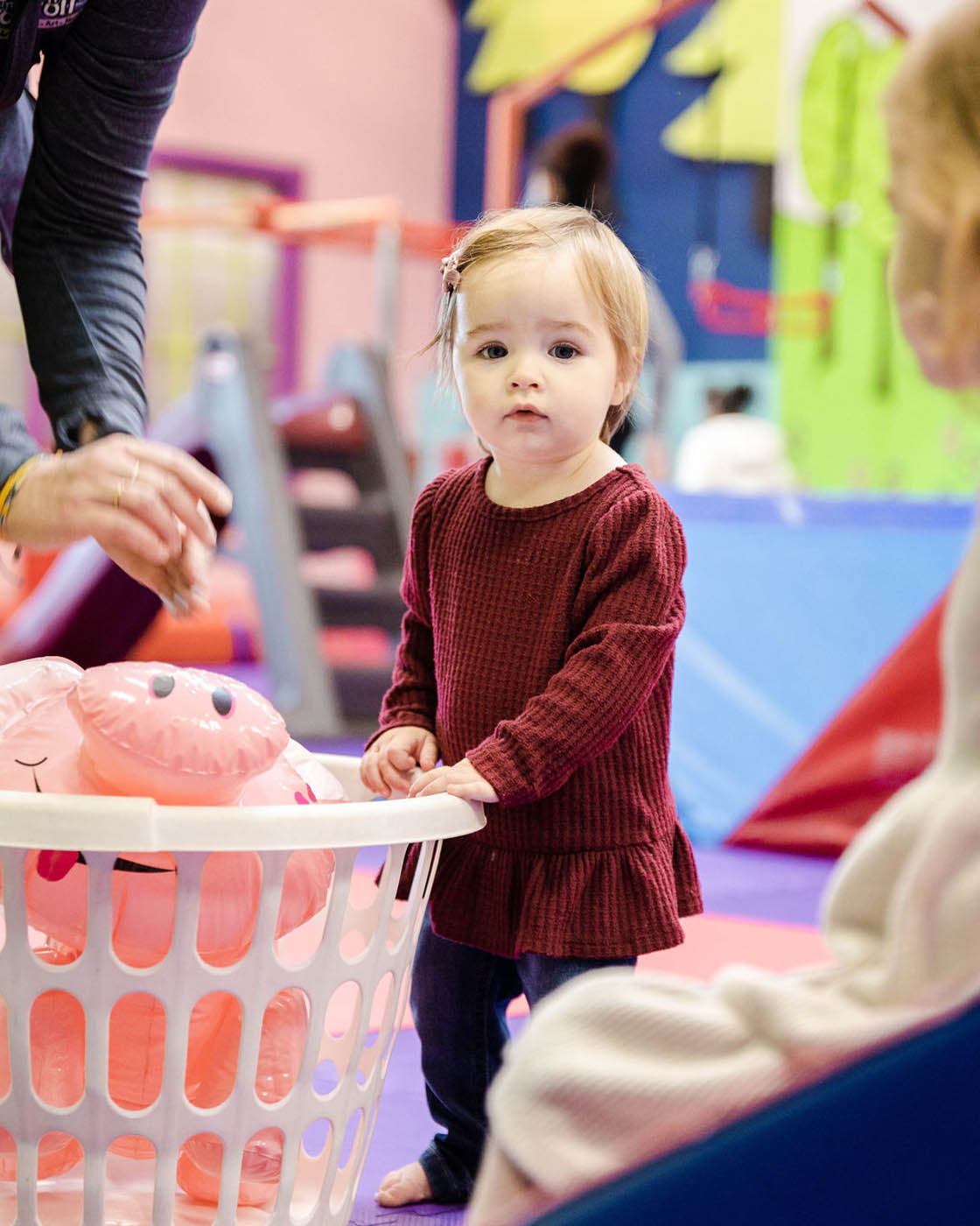 A girl enjoying the toys you can play with at Romp n' Roll in Midlothian.
