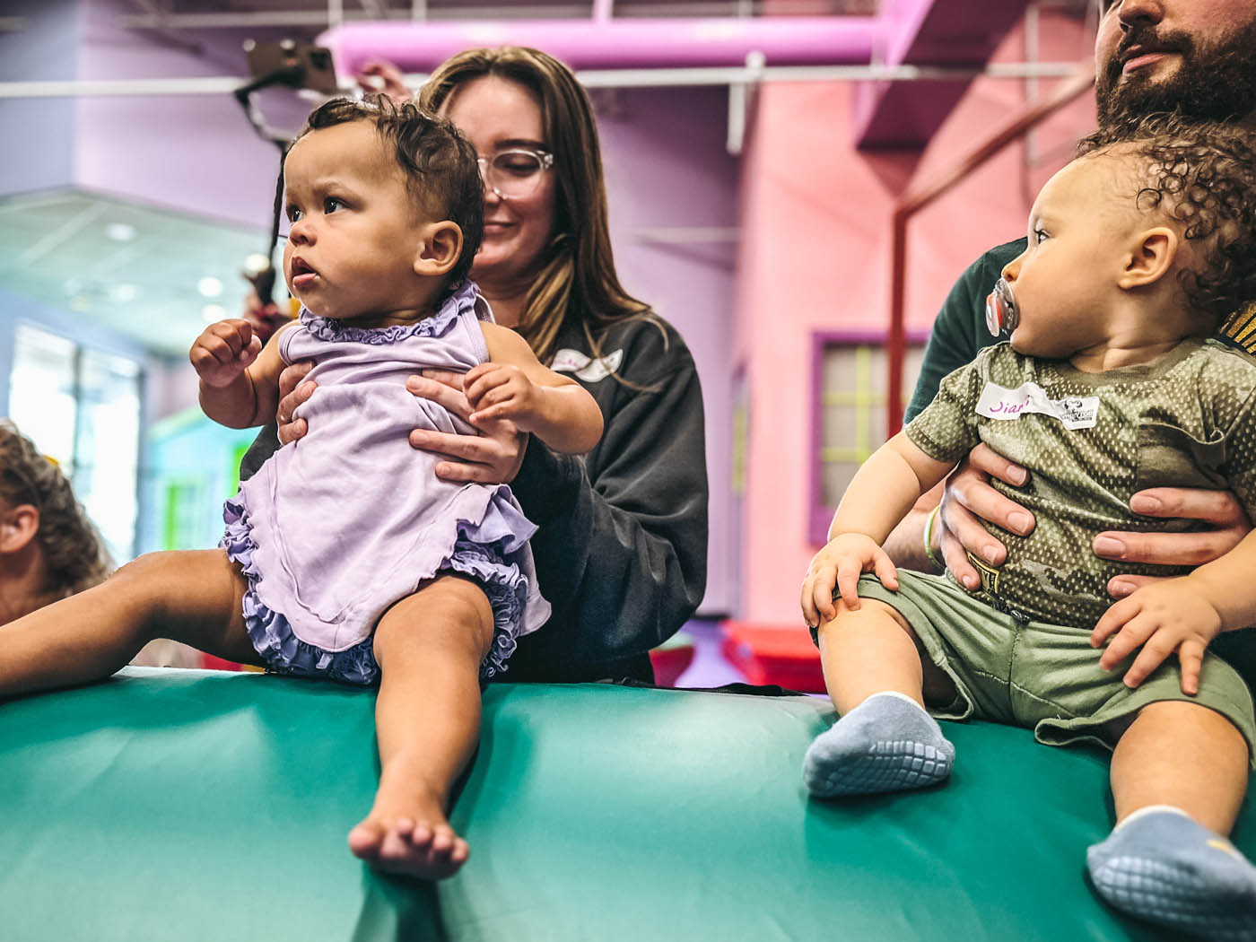 Adults with babies in Romp n' Roll's baby activities in Midlothian, VA.