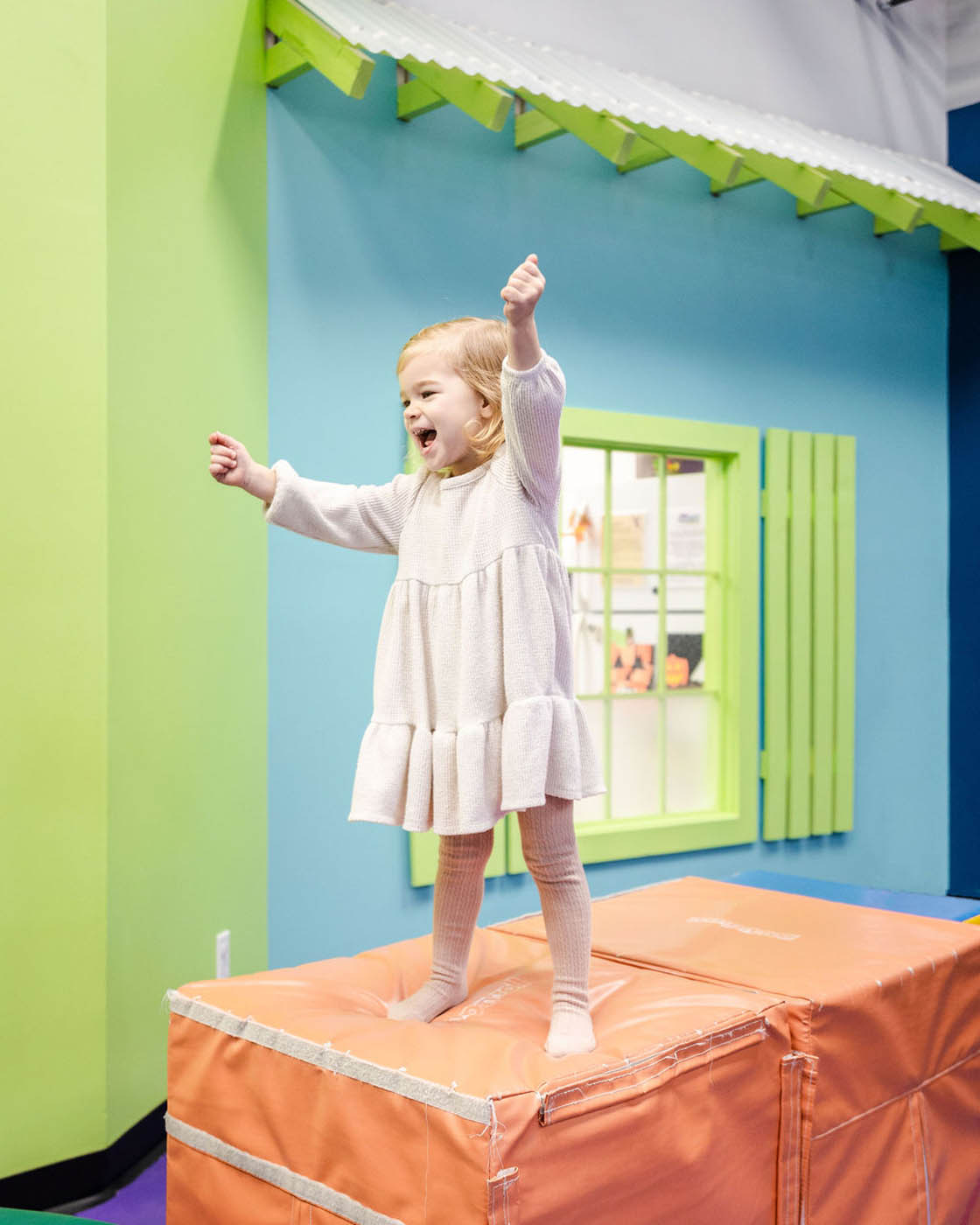 A little girl playing in one of Romp n' Roll North Raleigh's playgroups.
