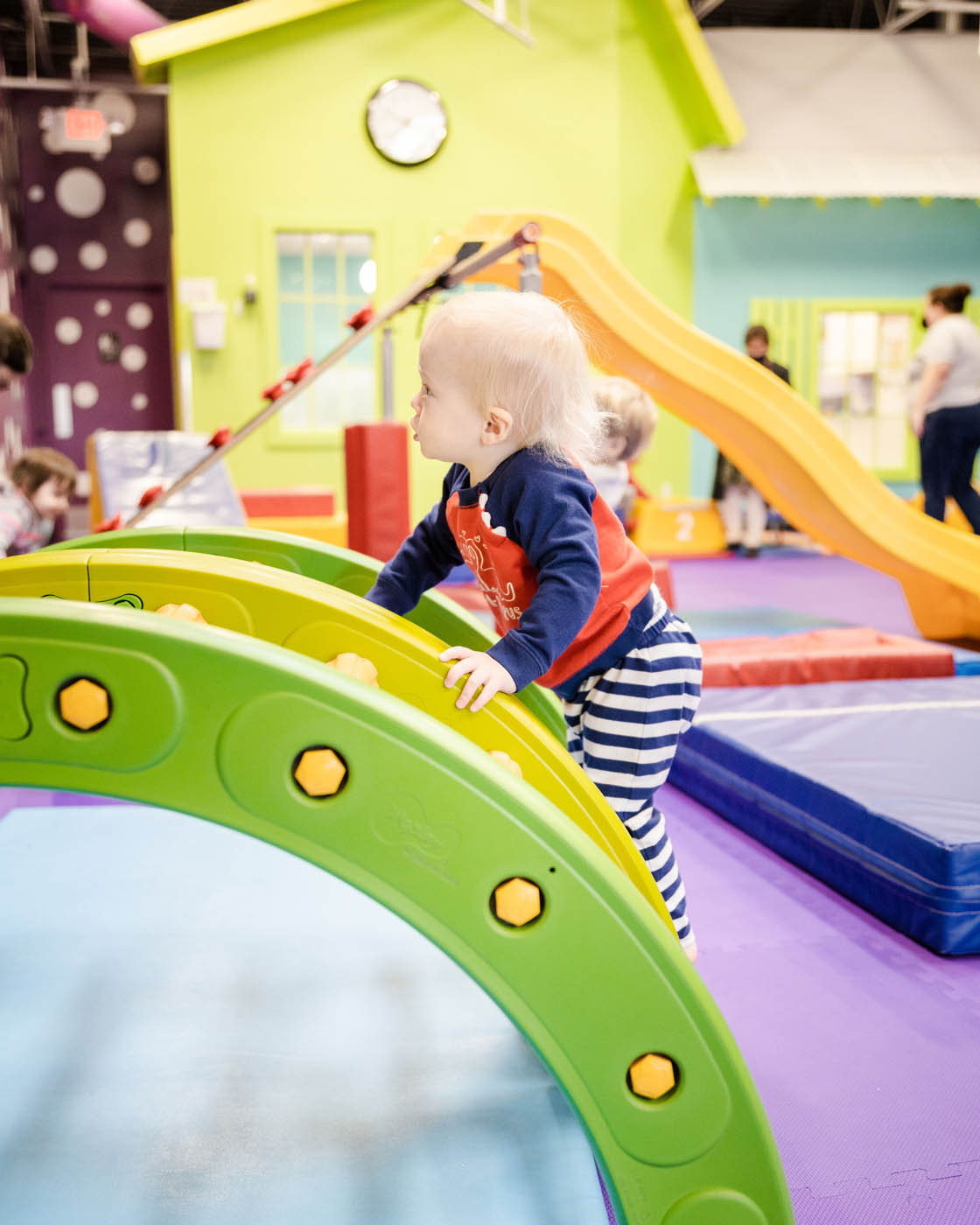 A little bloy playing on Romp n' Roll's indoor playground in Charlotte, NC.