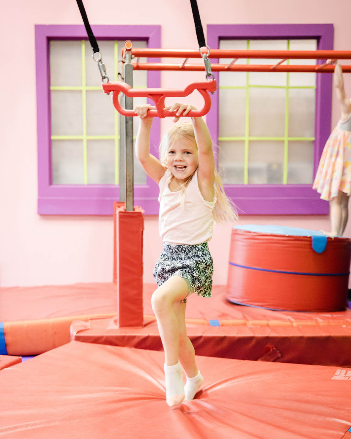 A little girl enjoying the Romp n' Roll gym, contact us today for more toddler activities in Katy.