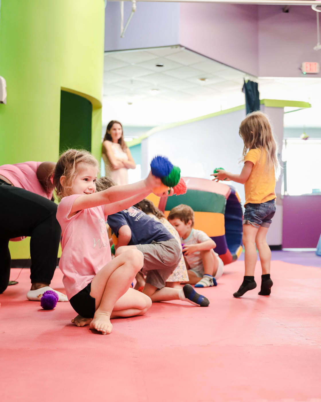 A group of boys and girls parctitipating in Romp n' Roll playgroup in Charlotte, NC.