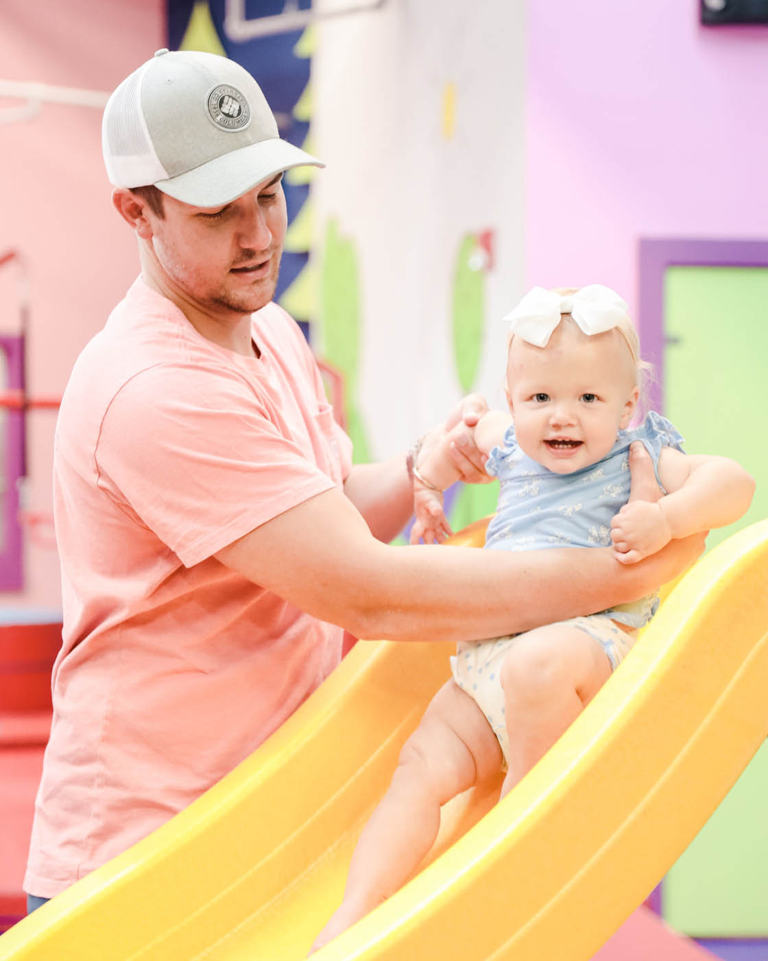 A dad and child playing at Romp n' Roll Wethersfield's family fun place.