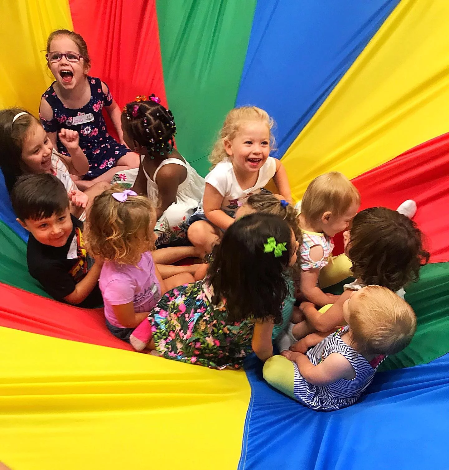 Kids at Romp n' Roll enjoying the gym equipment.