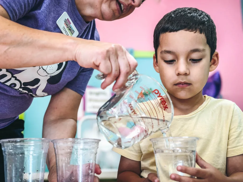 A little boy participating in a science class camp at Romp n' Roll.